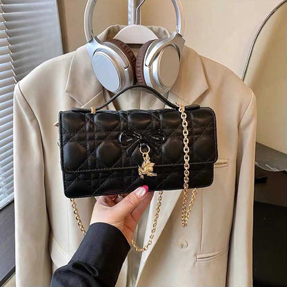 Bolso acolchado con lazo