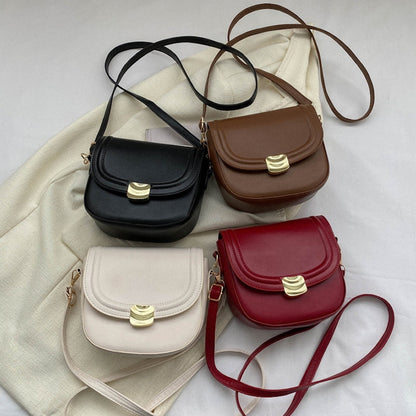 Bolso con botón dorado
